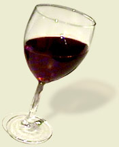 A tipsy glass of red wine